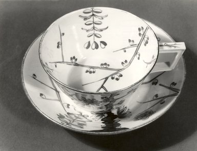 Derby Porcelain Factory (1750-present). <em>Cup and Saucer</em>, early 1780s. Porcelain with gilt rim to cup and saucer Brooklyn Museum, Gift of Martin Greenfield, 83.166.3a-b. Creative Commons-BY (Photo: Brooklyn Museum, CUR.83.166.3a-b_top_bw.jpg)
