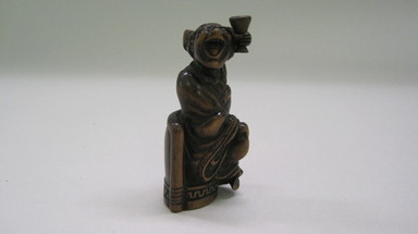  <em>Netsuke (Toggle)</em>. Ivory and wood, Height: 2 3/8 in. (6 cm). Brooklyn Museum, Gift of Maybelle M. Dore, 84.247.15. Creative Commons-BY (Photo: , CUR.84.247.15.jpg)