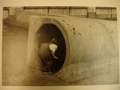 Len Bernstein (American, born 1950). <em>Girl Entering Tunnel</em>, 1982. Gelatin silver print, image: 6 1/8 x 9 in. (15.6 x 22.9 cm). Brooklyn Museum, Gift of the artist, 85.124.2. © artist or artist's estate (Photo: Brooklyn Museum, CUR.85.124.2.jpg)