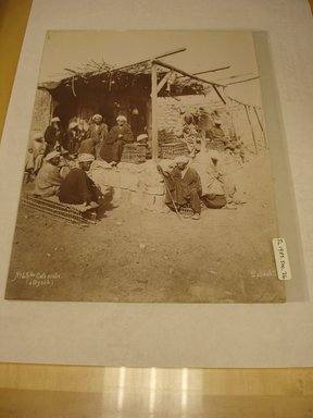 Pascal Sébah (Turkish, 1823-1886). <em>Egyptian Men at Cafe with a Thatched Roof</em>, late 19th century. Albumen silver print Brooklyn Museum, Gift of Matthew Dontzin, 85.305.26 (Photo: Brooklyn Museum, CUR.85.305.26.jpg)