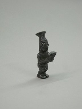 Chimú Inca. <em>Male Figurine Holding Panpipes</em>, before C.E. 1500. Silver, 2 1/16 x 11/16 x 13/16 in. (5.2 x 1.7 x 2.1 cm). Brooklyn Museum, Gift of the Ernest Erickson Foundation, Inc., 86.224.87. Creative Commons-BY (Photo: Brooklyn Museum, CUR.86.224.87.jpg)