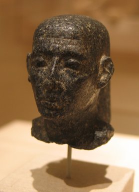  <em>Head of a Man with Shaven Skull and Large Ears</em>, ca. 310 or 305–30 B.C.E. Granite, 2 11/16 x 1 7/8 x 2 13/16 in. (6.8 x 4.7 x 7.1 cm). Brooklyn Museum, Gift of the Ernest Erickson Foundation, Inc., 86.226.13. Creative Commons-BY (Photo: Brooklyn Museum, CUR.86.226.13_wwg8.jpg)