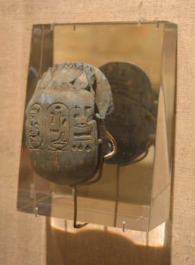  <em>Heart Scarab with Scene of the Goddess Ma`at and a Phoenix</em>, ca. 893-868 B.C.E. Egyptian blue (frit), traces of gold, 6 × 1 3/4 × 1 5/8 in. (15.2 × 4.4 × 4.1 cm). Brooklyn Museum, Gift of the Ernest Erickson Foundation, Inc., 86.226.22. Creative Commons-BY (Photo: Brooklyn Museum, CUR.86.226.22_wwgA-3.jpg)