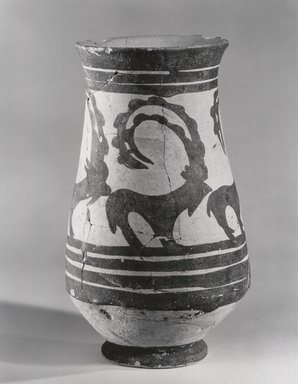 Sialk III. <em>Beaker with a Row of Ibexes</em>, 4th millenium B.C.E. Clay, slip, 7 1/4 x 3 3/8in. (18.4 x 8.6cm). Brooklyn Museum, Gift of the Ernest Erickson Foundation, Inc., 86.226.59. Creative Commons-BY (Photo: Brooklyn Museum, CUR.86.226.59_NegA_print_bw.jpg)