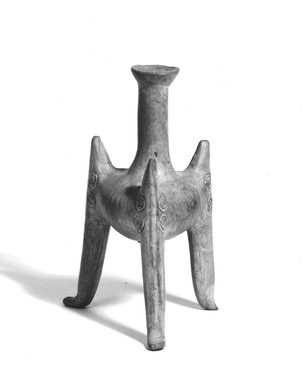  <em>Tripod Vase</em>, ca. 1200 B.C.E. Clay, slip, 5 x 3in. (12.7 x 7.6cm). Brooklyn Museum, Gift of the Ernest Erickson Foundation, Inc., 86.226.60. Creative Commons-BY (Photo: Brooklyn Museum, CUR.86.226.60_NegA_print_bw.jpg)