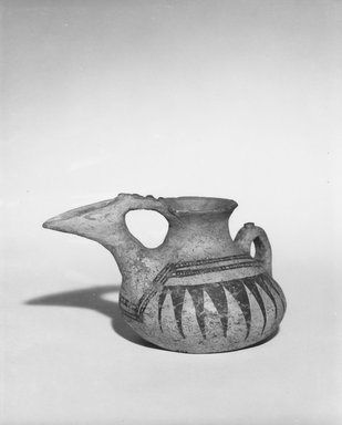  <em>Painted Ewer</em>, ca. 8th-7th century B.C.E. Clay, slip, Height: 3 1/2in. (8.9cm). Brooklyn Museum, Gift of the Ernest Erickson Foundation, Inc., 86.226.63. Creative Commons-BY (Photo: Brooklyn Museum, CUR.86.226.63_NegA_print_bw.jpg)
