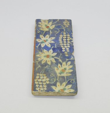  <em>Rectangular Tile</em>, 1560-1570. Ceramic, transparent colorless glaze, cobalt-blue, green, and   red underglaze, off-white body, 3 1/2 x 8 3/4 in. (8.9 x 22.2 cm). Brooklyn Museum, Gift of the Ernest Erickson Foundation, Inc., 86.227.198. Creative Commons-BY (Photo: Brooklyn Museum, CUR.86.227.198.jpg)