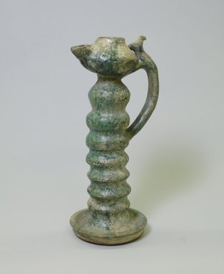  <em>Lamp with a Long Neck</em>, 12th century. Ceramic, turquoise glaze, 10 15/16 x 4 3/4 in. (27.8 x 12 cm). Brooklyn Museum, Gift of the Ernest Erickson Foundation, Inc., 86.227.68. Creative Commons-BY (Photo: Brooklyn Museum, CUR.86.227.68_view2.jpg)