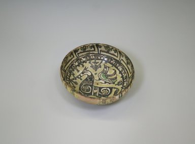  <em>Bowl</em>, 10th-12th century. Ceramic, white engobe, brown, yellow, and green slip, transparent colorless glaze, 2 1/2 x 6 3/4 in. (6.3 x 17.1 cm). Brooklyn Museum, Gift of the Ernest Erickson Foundation, Inc., 86.227.84. Creative Commons-BY (Photo: Brooklyn Museum, CUR.86.227.84_interior.jpg)