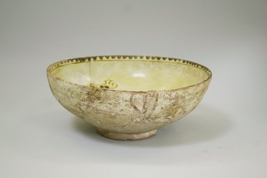  <em>Bowl</em>, 10th century. Ceramic, transparent colorless glaze, yellow-staining black slipwhite engobe, buff earthenware body, 3 3/8 x 8 7/16 in. (8.5 x 21.5 cm). Brooklyn Museum, Gift of the Ernest Erickson Foundation, Inc., 86.227.85. Creative Commons-BY (Photo: Brooklyn Museum, CUR.86.227.85_exterior.jpg)