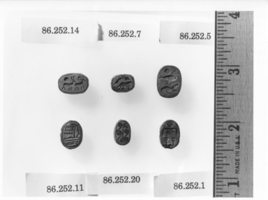  <em>Scarab Inscribed for Amenemhat II</em>. Stone, glaze, 1/4 × 9/16 in. (0.6 × 1.4 cm). Brooklyn Museum, Gift of Jerome A. and Mary Jane Straka, 86.252.1. Creative Commons-BY (Photo: , CUR.86.252.1_86.252.5_86.252.7_86.252.14_86.252.11_86.252.20_NegID_86.252.1_GRPC_print_bw.jpg)