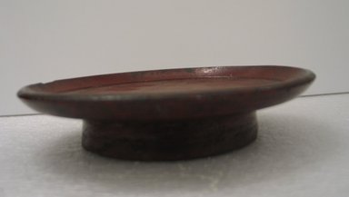 <em>Folk - Lacquer Offering Stand</em>, 17th century. Turned wood coated with lacquer, 1 5/8 x 7 1/4 in. (4.1 x 18.4 cm). Brooklyn Museum, Gift of Dr. Hugo Munsterberg, 87.129.2. Creative Commons-BY (Photo: Brooklyn Museum, CUR.87.129.2_side.jpg)