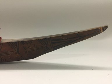 Santa Cruz Islander. <em>Club in Form of Boat</em>. Wood, coir, pigment, cloth, shell beads, 3 3/4 x 2 1/4 x 35 in. (9.5 x 5.7 x 88.9 cm). Brooklyn Museum, Gift of Marcia and John Friede and Mrs. Melville W. Hall, 87.218.81. Creative Commons-BY (Photo: , CUR.87.218.81_detail06.jpg)