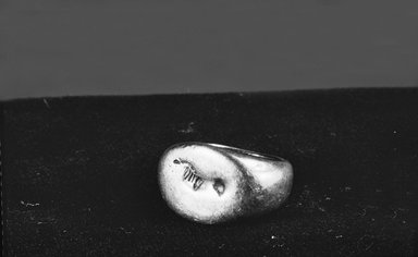  <em>Ring</em>, 6th-5th century B.C.E. Silver, Diam. 7/8 x 11/16 in. (Diam. 2.2 x 1.8 cm). Brooklyn Museum, Gift of Vincent L. Harper, 88.203. Creative Commons-BY (Photo: Brooklyn Museum, CUR.88.203_NegA_bw.jpg)