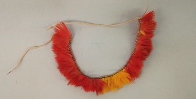 Kaapor. <em>Pair of Bracelets</em>, 20th century. Feathers, plant fiber, A: 4 × 4 1/4 × 3/4 in. (10.2 × 10.8 × 1.9 cm). Brooklyn Museum, Anonymous gift, 88.89.5a-b. Creative Commons-BY (Photo: Brooklyn Museum, CUR.88.89.5B.jpg)