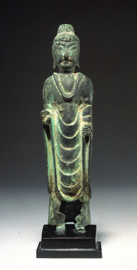  <em>Figure of Standing Seokga (Shakyamuni) Buddha</em>, ca. 6th-7th century. Bronze, height: 10 5/8 in. (27.0 cm). Lent by the Carroll Family Collection, L2021.3.2 (Photo: , CUR.L2021.3.2.jpg)
