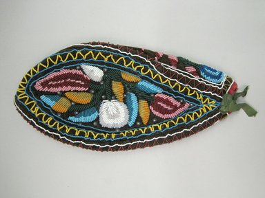 Iroquois. <em>Glengarry Cap</em>, ca. 1870. Cloth, beads, ribbon, 5 3/8 × 3 9/16 × 10 7/8 in. (13.7 × 9 × 27.6 cm). Brooklyn Museum, Gift of the Edward J. Guarino Collection in memory of Edgar J. Guarino, 2016.11.14. Creative Commons-BY (Photo: Brooklyn Museum, CUR.TL2016.18.14_view1.jpg)