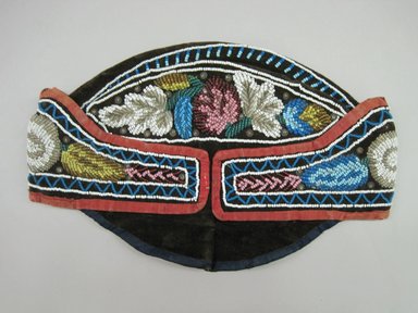 Haudenosaunee. <em>English Style Cap</em>, ca. 1880-1900. Velvet, cloth, beads, Including front flap: 11 1/4 × 6 × 7 7/8 in. (28.6 × 15.2 × 20 cm). Brooklyn Museum, Gift of the Edward J. Guarino Collection in memory of Edgar J. Guarino, 2016.11.16. Creative Commons-BY (Photo: Brooklyn Museum, CUR.TL2016.18.16_view1.jpg)
