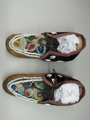 Haudenosaunee. <em>Moccasins</em>, ca. 1800s. Hide, velvet, cloth, beads, 3 × 3 7/8 × 10 1/8 in. (7.6 × 9.8 × 25.7 cm). Brooklyn Museum, Gift of the Edward J. Guarino Collection in memory of Edgar J. Guarino, 2016.11.23a-b. Creative Commons-BY (Photo: Brooklyn Museum, CUR.TL2016.18.23_top.jpg)