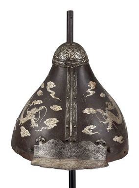  <em>Helmet</em>, 17th – 18th century. Iron, silver, 6 11/16 × 8 15/16 × 10 7/16 in. (17 × 22.7 × 26.5 cm). Lent by the Carroll Family Collection, L2024.1.4 (Photo: Photo: Bonhams, CUR.TL2023.38_overall.jpg)