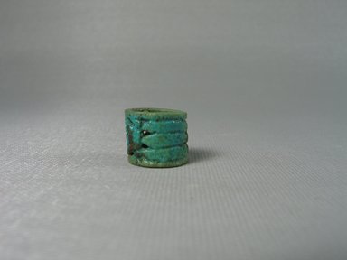  <em>Ring of Cylindrical Form</em>, ca. 1292-1075 B.C.E. Faience, 9/16 x diam. 11/16 in. (1.4 x 1.7 cm). Brooklyn Museum, Brooklyn Museum Collection, X20.4. Creative Commons-BY (Photo: Brooklyn Museum, CUR.X20.4_view3.jpg)