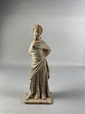 Greek. <em>Standing Figure of Woman, Tanagra Style</em>. Terracotta, pigment, 6 1/2 in.  (16.5 cm). Brooklyn Museum, Brooklyn Museum Collection, X249.74. Creative Commons-BY (Photo: Brooklyn Museum, CUR.X249.74_view01.jpeg)