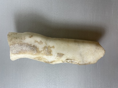Roman (probably). <em>Fragment of Left Leg</em>. Marble, 3 9/16 × 3 15/16 × 11 in. (9 × 10 × 28 cm). Brooklyn Museum, Brooklyn Museum Collection, X605.1. Creative Commons-BY (Photo: Brooklyn Museum, CUR.X605.1_view01.jpg)