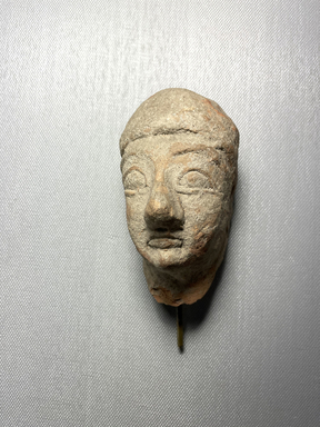 Cypriot. <em>Fragmentary Head and Part of Neck</em>, ca. 600-480 BCE. Terracotta, 4 1/4 × 2 5/16 × 2 5/16 in. (10.8 × 5.8 × 5.8 cm). Brooklyn Museum, Brooklyn Museum Collection, X611. Creative Commons-BY (Photo: Brooklyn Museum, CUR.X611_view01.jpeg)