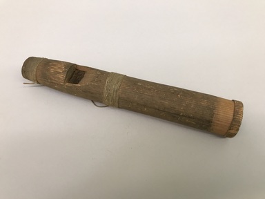 Possibly Tsimshian. <em>Whistle</em>, 1868-1901. Wood, string, 1 1/2 × 1 1/2 × 10 in. (3.8 × 3.8 × 25.4 cm). Brooklyn Museum, Brooklyn Museum Collection, X844.21. Creative Commons-BY (Photo: Brooklyn Museum, CUR.X844.21_view01.jpg)