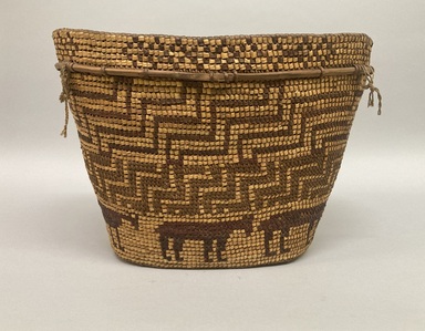 Tsilhqot'in. <em>Coiled Burden Basket</em>, 1901-1933. Plant fiber, wood, 10 × 14 1/8 × 10 3/4 in. (25.4 × 35.9 × 27.3 cm). Brooklyn Museum, Brooklyn Museum Collection, X854.9. Creative Commons-BY (Photo: Brooklyn Museum, CUR.X854.9_overall01.JPG)