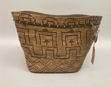 Tsilhqot'in. <em>Coiled Burden Basket</em>, 1868-1933. Plant fiber, wood, 11 3/8 × 15 5/8 × 11 9/16 in. (28.9 × 39.7 × 29.4 cm). Brooklyn Museum, Gift of George D. Pratt, 15.526.12. Creative Commons-BY (Photo: Brooklyn Museum, CUR.X856.12_overall01.JPG)