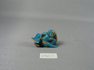  <em>One Erotic Figure of a Male</em>, 305-30 B.C.E. Faience, 1 7/16 x 2 1/8 x 3/4 in. (3.7 x 5.4 x 1.9 cm). Brooklyn Museum, Brooklyn Museum Collection, X865.4. Creative Commons-BY (Photo: Brooklyn Museum, CUR.X865.4_view1.jpg)