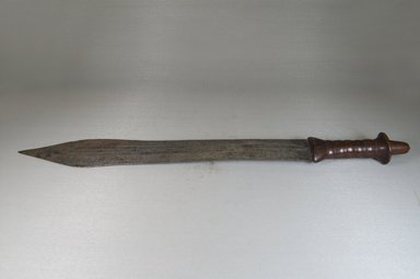 Possibly Yaka. <em>Sword with Richly Patinated Wood Hilt</em>, late 19th century. Iron, wood, 2 1/2 x 56 1/2 in. (6.4 x 143.5 cm). Brooklyn Museum, Brooklyn Museum Collection, X956.12. Creative Commons-BY (Photo: Brooklyn Museum, CUR.X956.12_side_PS5.jpg)