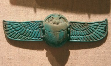  <em>Winged Scarab</em>, 664-332 B.C.E. Faience, 1/2 x 1 1/16 x 1 5/16 in. (1.2 x 2.7 x 3.3 cm). Brooklyn Museum, Gift of the Egypt Exploration Fund, 15.523. Creative Commons-BY (Photo: Brooklyn Museum, CUR.x249.42_wwgA-3.jpg)