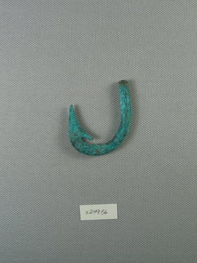  <em>Fish Hook</em>. Bronze, 1 7/8 x 1 5/8 x 9/16 in. (4.8 x 4.2 x 1.5 cm). Brooklyn Museum, Brooklyn Museum Collection, X249.56. Creative Commons-BY (Photo: Brooklyn Museum, CUR.x249.56_view1.jpg)