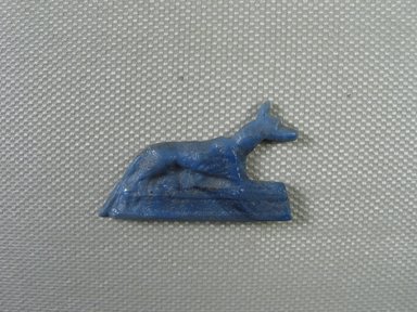  <em>Figure of a Jackal</em>, 664–30 B.C.E. Glass, 7/8 x 1/8 x 1 7/16 in. (2.2 x 0.3 x 3.7 cm). Brooklyn Museum, Gift of Evangeline Wilbour Blashfield, Theodora Wilbour, and Victor Wilbour honoring the wishes of their mother, Charlotte Beebe Wilbour, as a memorial to their father, Charles Edwin Wilbour, 16.580.118. Creative Commons-BY (Photo: Brooklyn Museum, CUR_16.580.118_view01.jpg)