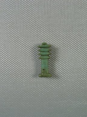  <em>Djed-pillar Amulet</em>, 664-332 B.C.E., or later. Faience, 7/8 x 3/8 x 3/16 in. (2.3 x 0.9 x 0.5 cm). Brooklyn Museum, Brooklyn Museum Collection, X249.33. Creative Commons-BY (Photo: Brooklyn Museum, CUR_X249.33_view01.jpg)