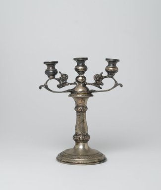 Jewish. <em>Sabbath Candelabrum</em>, early 20th century. Silver, 7 1/4 x 6 1/4 x 3 3/4 in. (18.4 x 15.9 x 9.5 cm). Loaned by Jewish Cultural Reconstruction, Inc., L50.26.12. Creative Commons-BY (Photo: Brooklyn Museum, L50.26.12_PS2.jpg)