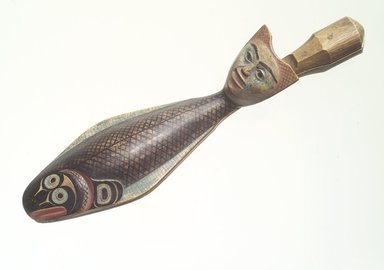 Charles Edenshaw (Haida, 1834–1924). <em>Clapper in Form of a Fish with Human Head for Finger Lever</em>, pre–1864. Cedar wood, pigment, 9 3/4 x 2 3/4 in. (24.8 x 7.0 cm). Collection of Christopher B. Martin, L61.3.1. Creative Commons-BY (Photo: Brooklyn Museum, L61.3.1_transp5628.jpg)