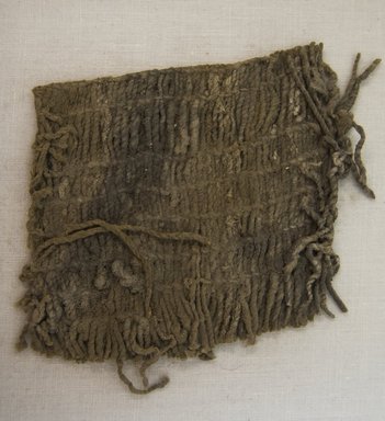 Huaca Prieta. <em>Textile Fragment, undetermined</em>, 3000-1800 B.C.E. Cotton, 2 3/4 x 3 9/16in. (7 x 9cm). Brooklyn Museum, Brooklyn Museum Collection, X1048.1. Creative Commons-BY (Photo: Brooklyn Museum, X1048.1_front_PS5.jpg)