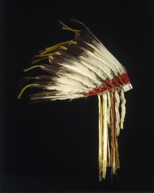 Osage. <em>Headdress</em>, late 19th–early 20th century. Wool, felt, cloth, golden eagle feathers, horse hair, glass beads, hide, weasel fur, silk, sinew, 16 1/2 x 22 x 22 in. (41.9 x 55.9 x 55.9 cm). Brooklyn Museum, Brooklyn Museum Collection, X1053. Creative Commons-BY (Photo: Justin Kerr, X1053_SL1.jpg)