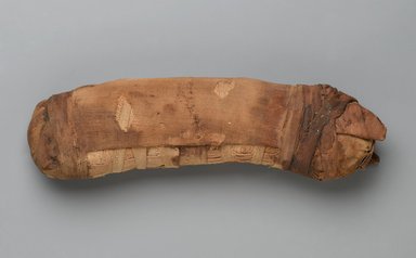Egyptian. <em>Bundle in Form of Cat Mummy</em>, 664-30 B.C.E. Linen, stones, soil, plant matter, 2 1/8 x 3 x 10 3/8 in. (5.4 x 7.6 x 26.4 cm). Brooklyn Museum, Brooklyn Museum Collection, X1179.3. Creative Commons-BY (Photo: Brooklyn Museum, X1179.3_PS2.jpg)