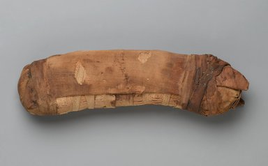 Egyptian. <em>Bundle in Form of Cat Mummy</em>, 664–30 B.C.E. Linen, stones, soil, plant matter, 2 1/8 x 3 x 10 3/8 in. (5.4 x 7.6 x 26.4 cm). Brooklyn Museum, Brooklyn Museum Collection, X1179.3. Creative Commons-BY (Photo: Brooklyn Museum, X1179.3_PS2.jpg)