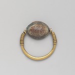 Cowrie-Shaped Amulet in Gold Ring