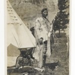 [Untitled] (Chief Standing in front of Teepee with Seated Woman)