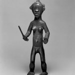 Standing Female Nude Holding a Knife