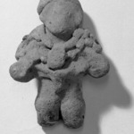 Figure Wearing Necklace