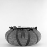 Large Basket made with the shi-bu technique and decorated with woven design of a man