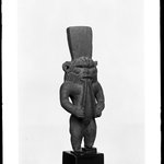 Figure of the God Bes Playing on a Pair of Flutes