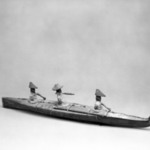 Model of Bidarka Boat with three seated figures